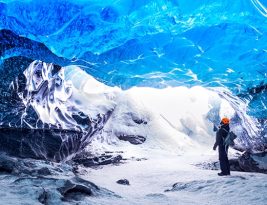 Traveller Visiting Ice Cave With Amazing Eye-catching Scenes